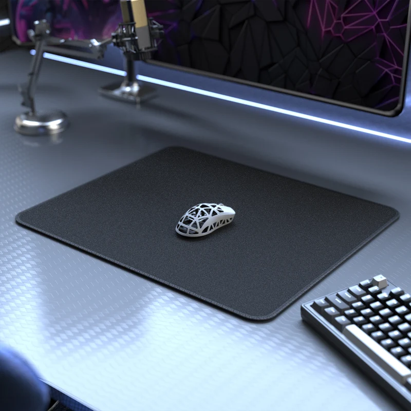 Orange Attack Shark gaming mouse pad enhancing mouse glide with gaming mouse on top.